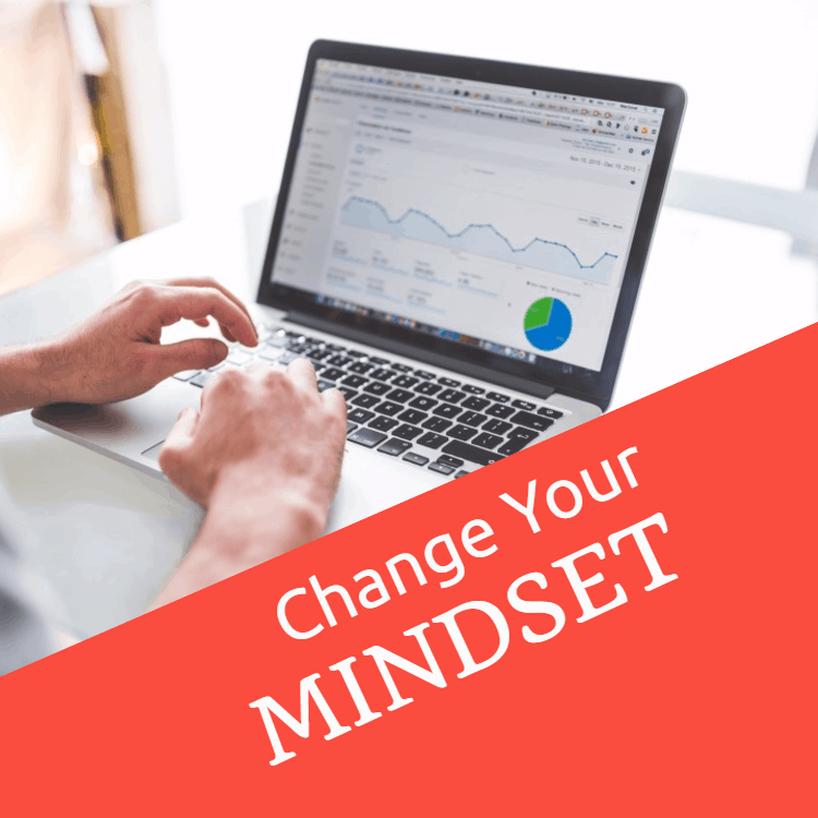 Hand with marker writing: Change Your Mindset